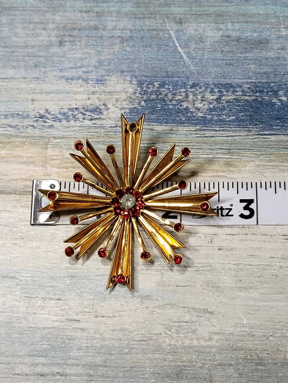 Gold Starburst Brooch and Earring Set with Red Rhinestones